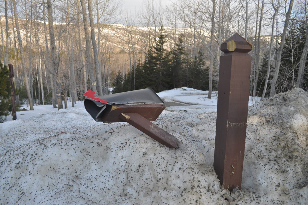 Mailbox damaged from snow and ice