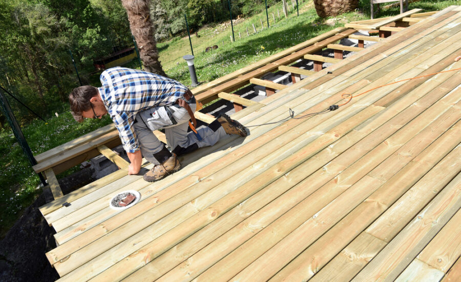 deck repairs being done by skilled carpenter at Pink Hammer Home